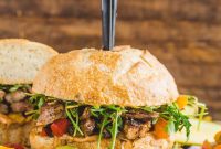 Spicy Cajun Steak Sandwich with Caramelized Onions and Bell Peppers