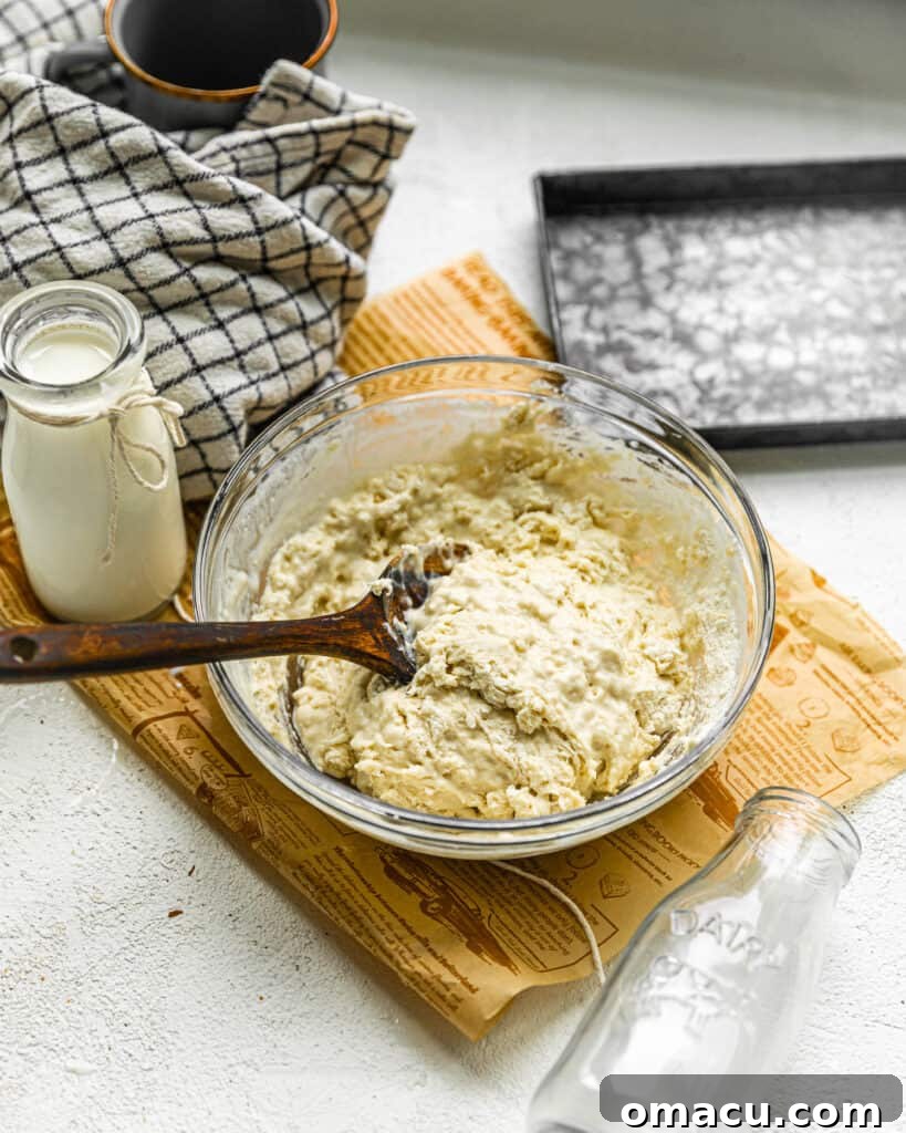 A smooth, creamy batter being mixed in a bowl, its consistency perfect for fluffy pancakes or tender baked goods, thanks to buttermilk.