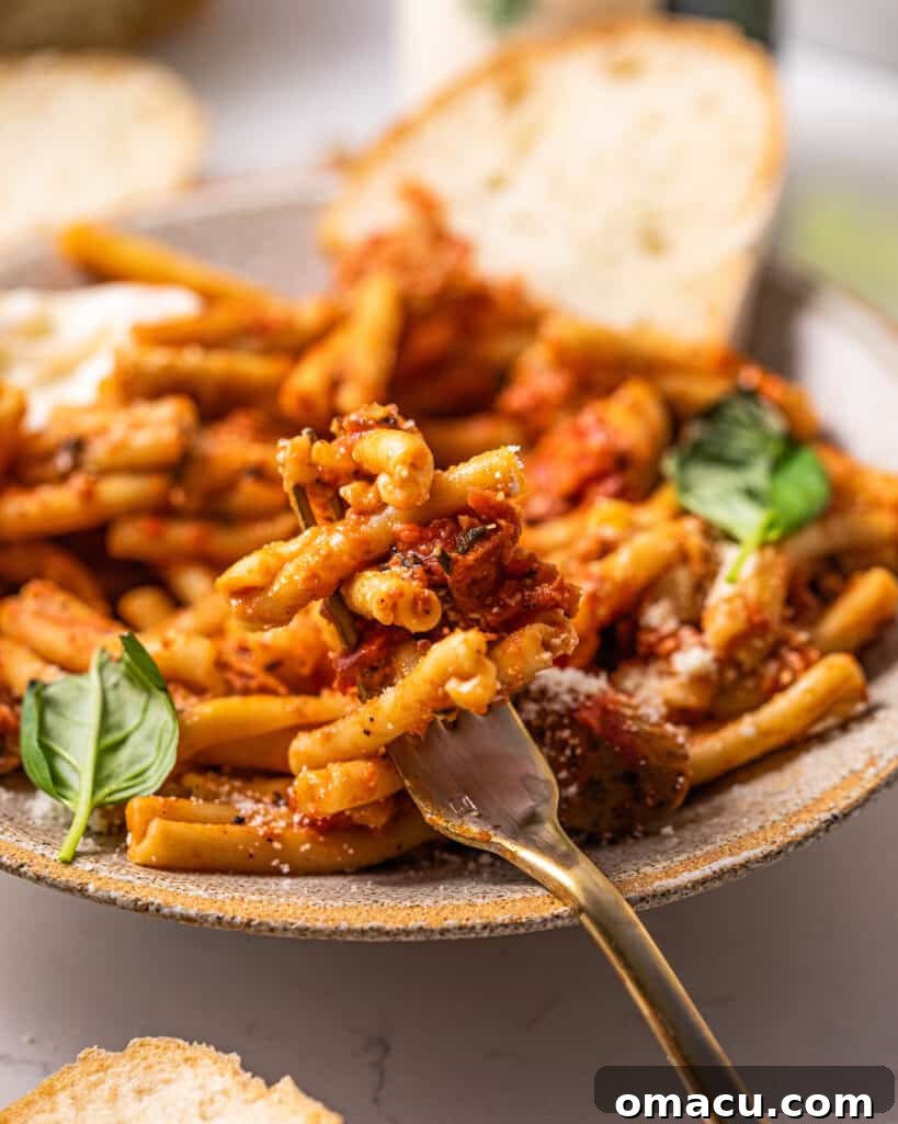 pasta on a fork sitting in a bowl