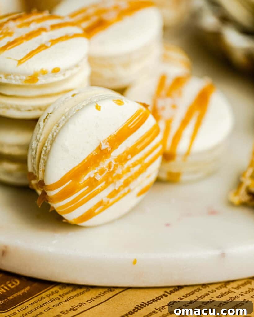salted caramel macarons on a marble surface