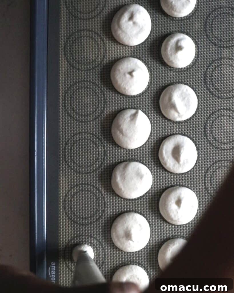 macarons on a silicone macaron mat