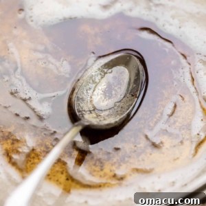 brown butter in a pan with a spoon