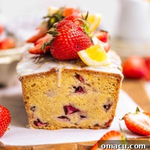 Delicious strawberry bread loaf on a wooden board