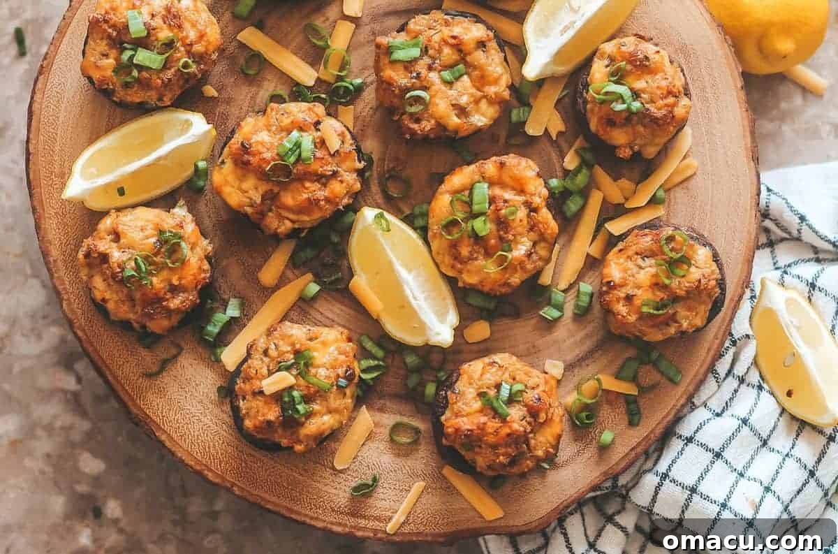 Exquisite Cheesy Old Bay Crab Stuffed Mushrooms, golden-brown and ready to be served