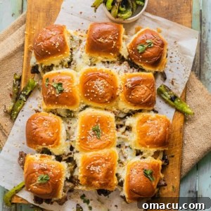 Philly Cheesesteak Sliders fresh out of the oven on a table, ready to be served