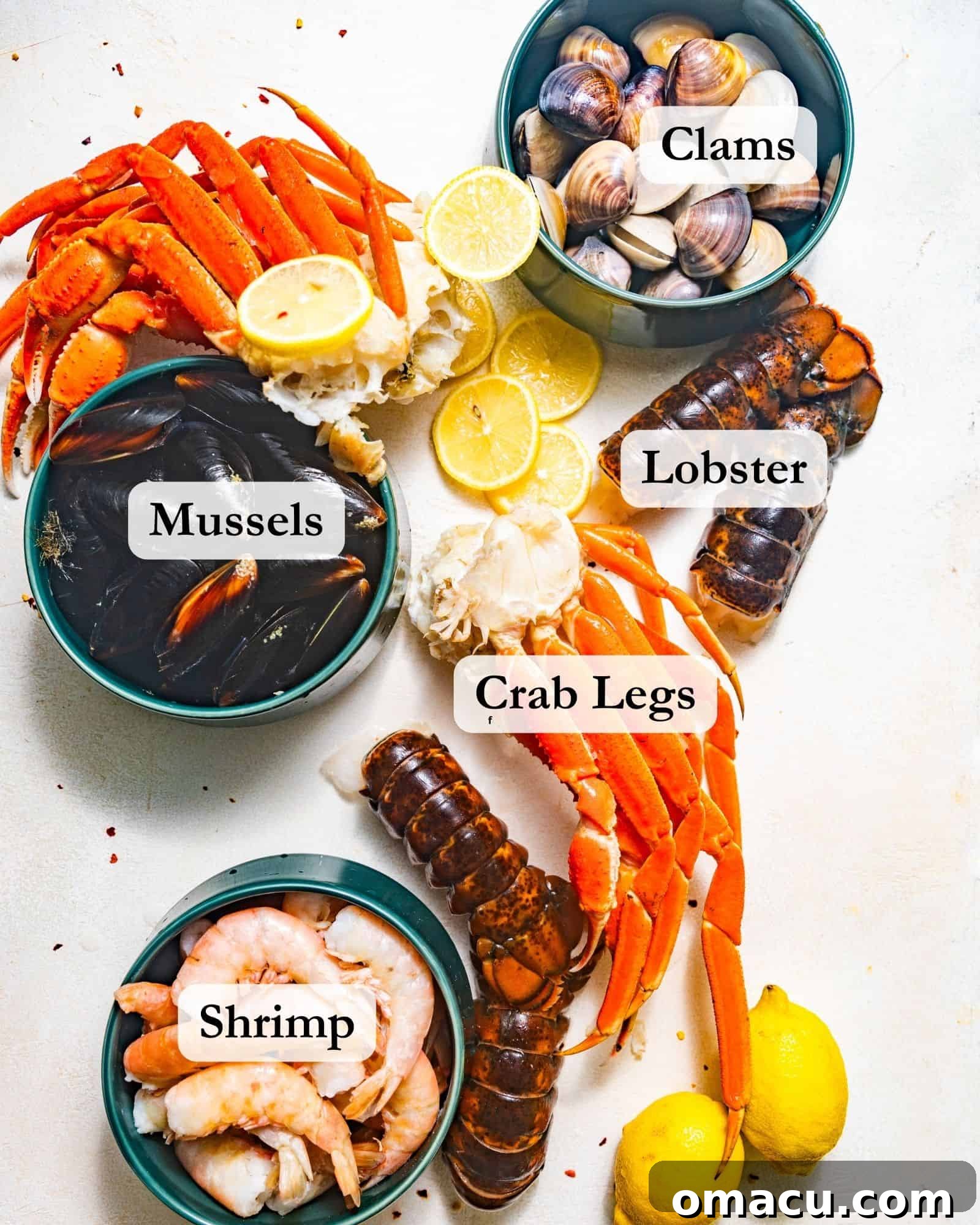 An array of fresh seafood ingredients laid out on a white surface, including large jumbo shrimp, succulent lobster tails, delicate snow crab legs, fresh mussels, and sweet clams, all ready for a cajun seafood boil.