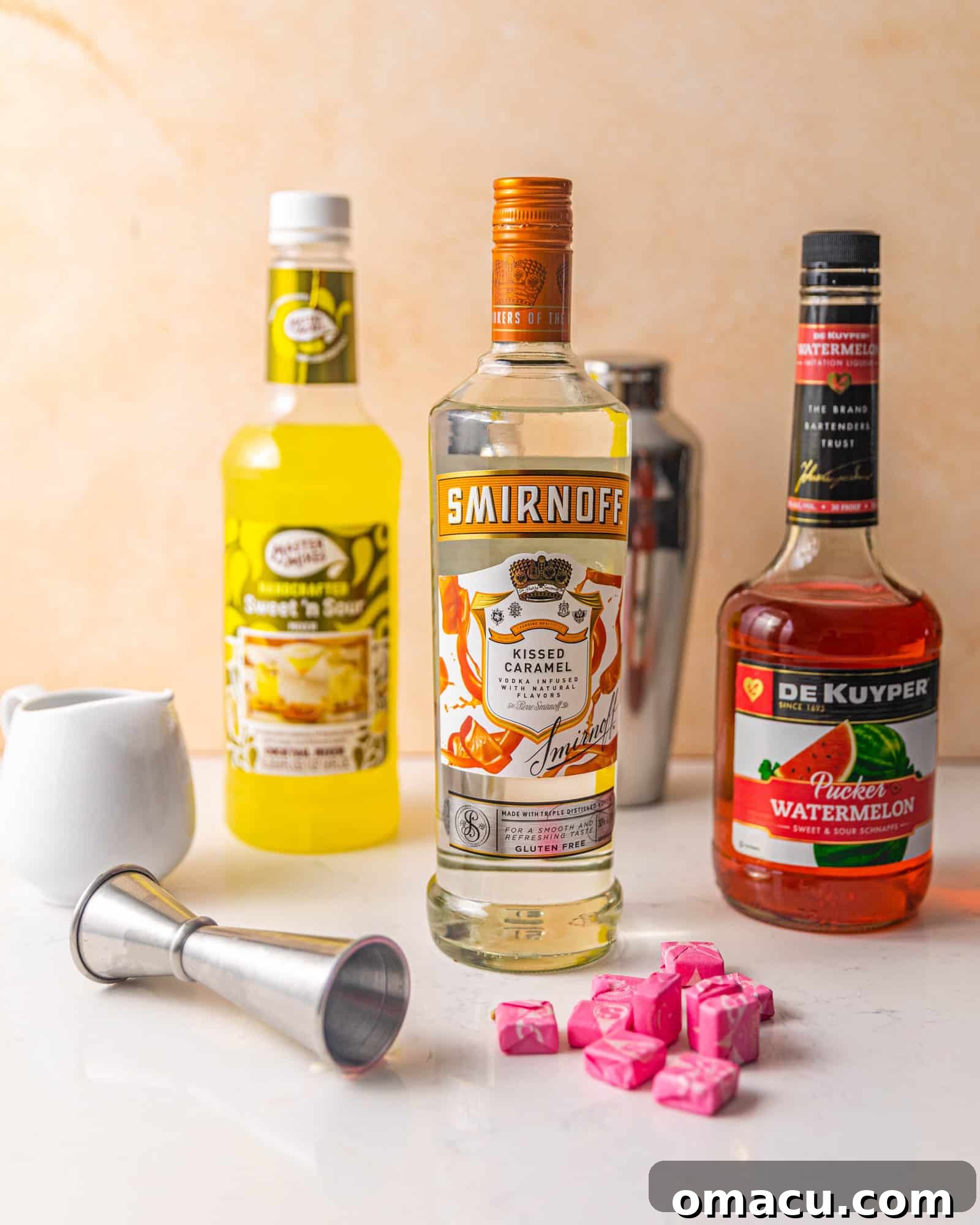 Essential ingredients laid out for crafting delicious Starburst shots, showcasing vibrant colors.