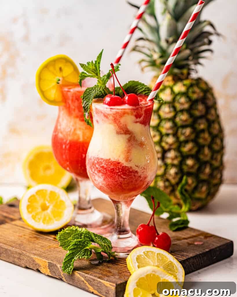 Two exquisitely prepared Miami Vice Drinks resting on a serving tray, with a fresh pineapple in the background, symbolizing tropical luxury.