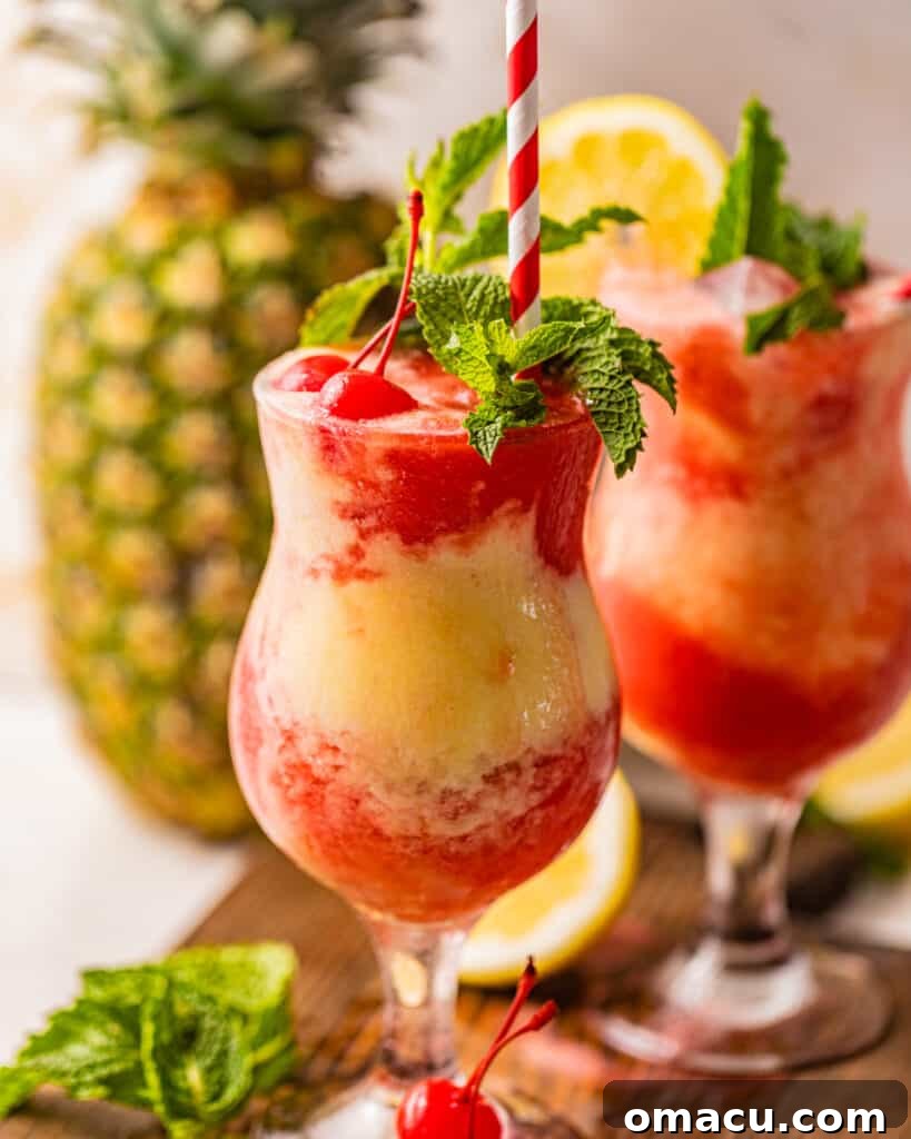 An inviting close-up of a frozen rum cocktail, elegantly garnished with fresh mint, juicy cherries, and a vibrant lemon wedge, ready to be enjoyed.