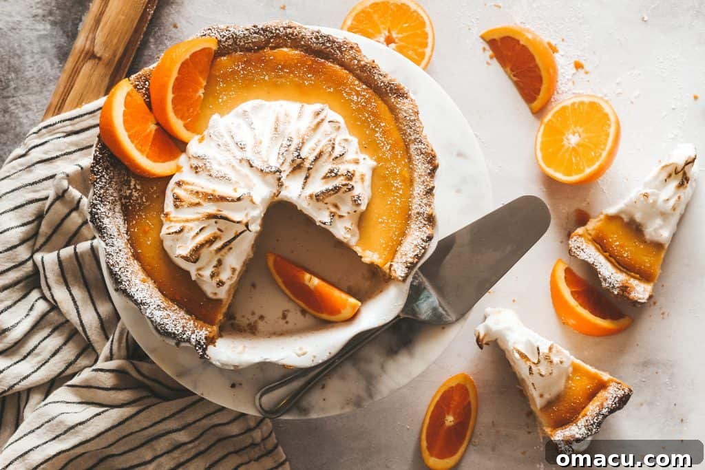 blood orange ricotta pie beautifully presented on a white marble cake stand