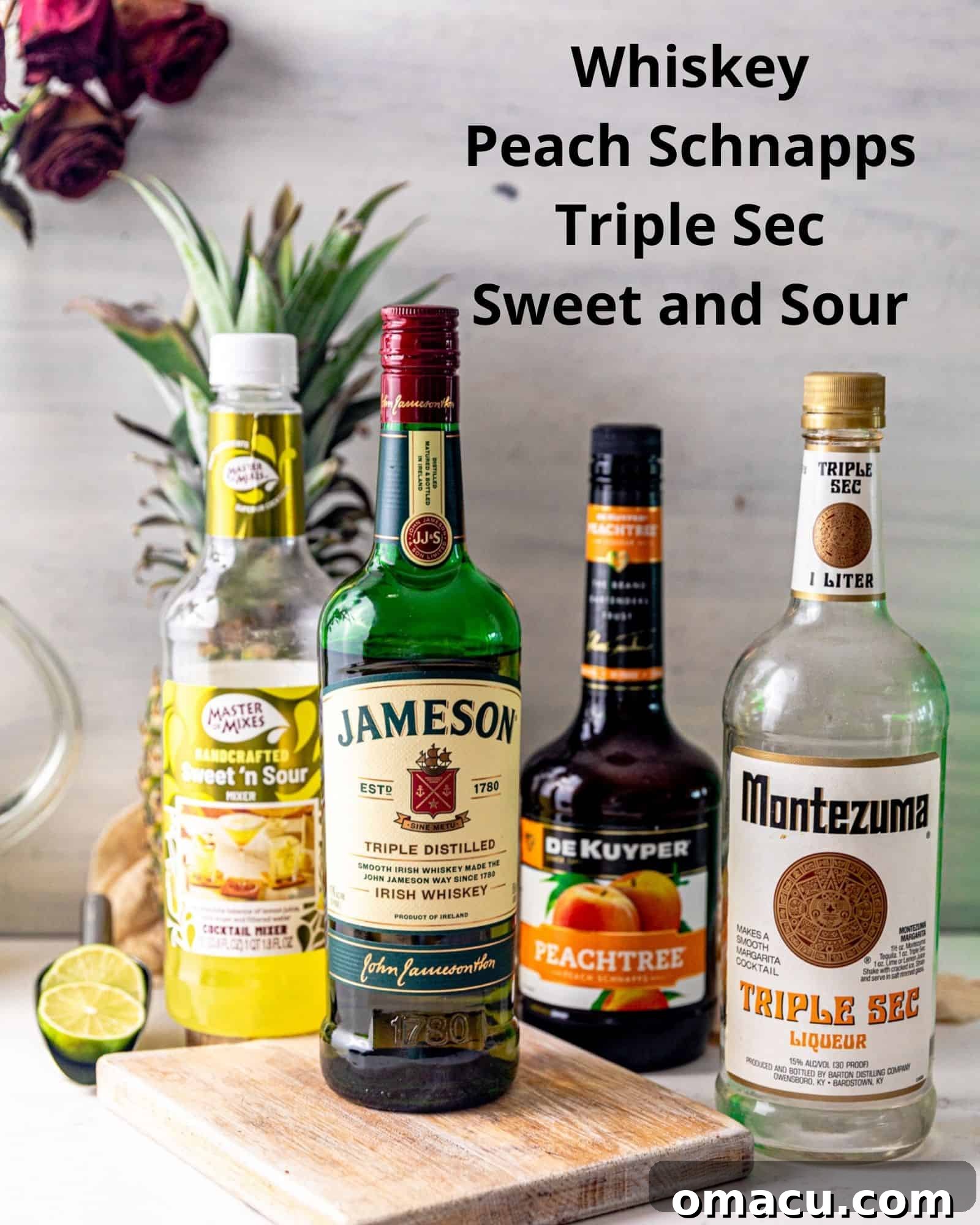Essential ingredients for making a Water Moccasin shot: a bottle of whiskey, peach schnapps, triple sec, and a bottle of sweet and sour mix, neatly arranged.
