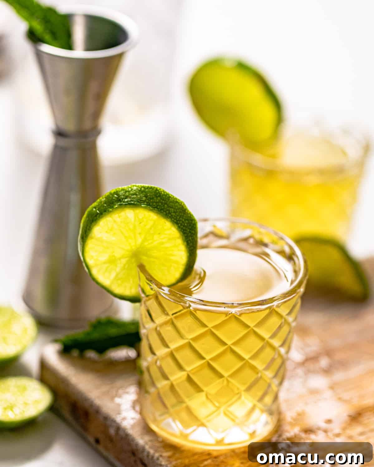 A single Water Moccasin shot in a shot glass, perfectly mixed and ready to be enjoyed, showcasing its smooth amber hue.
