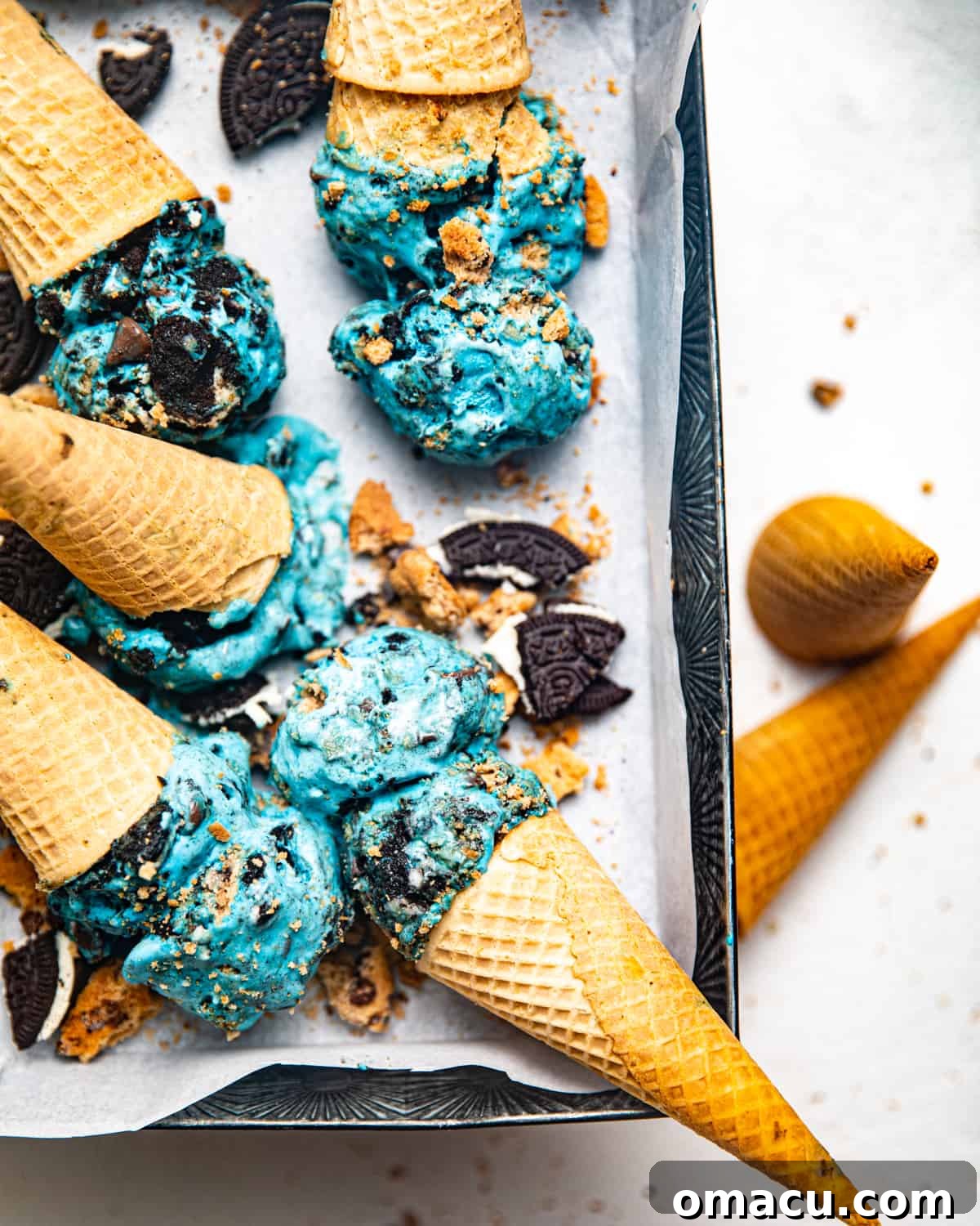 cookie monster ice cream in ice cream cones in a loaf pan.
