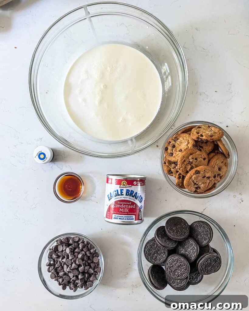 ingredients to make cookie monster ice cream - heavy whipping cream, chocolate chip cookies, oreo cookies, chocolate chips, sweetened condensed milk, vanilla extract, and blue food coloring.