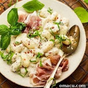Creamy Cacio e Pepe Gnocchi on a plate.