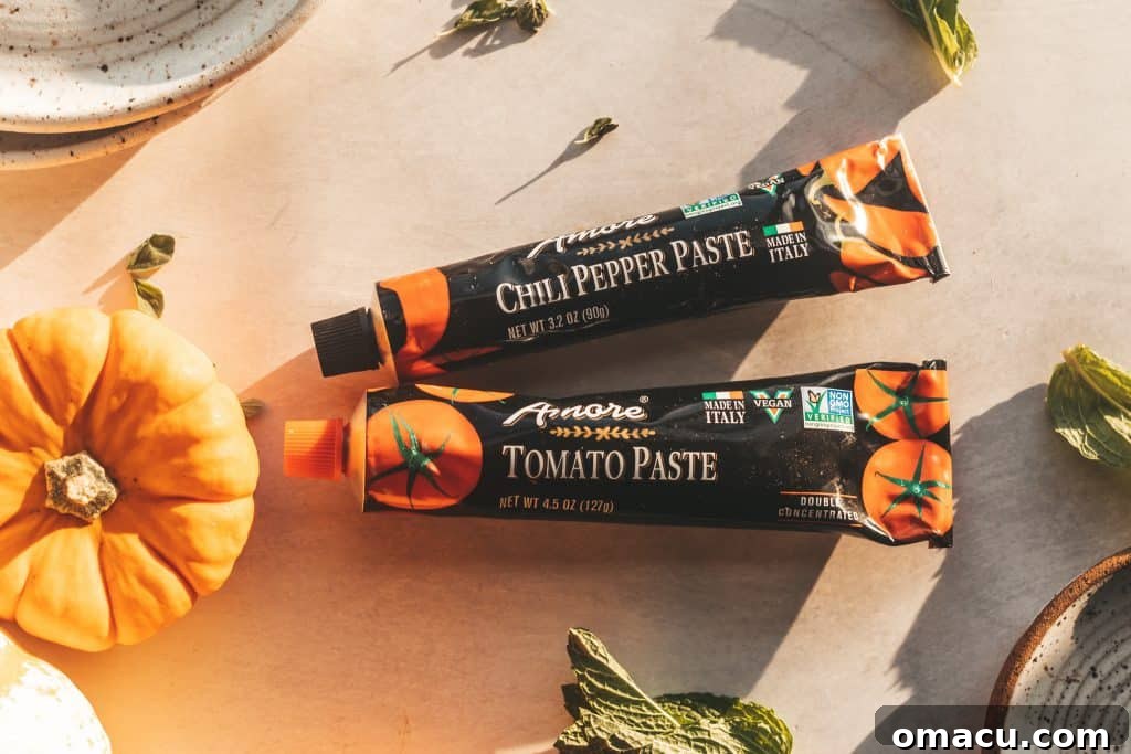 Several tubes of Amore tomato paste, showcasing the convenient and fresh Italian ingredient.