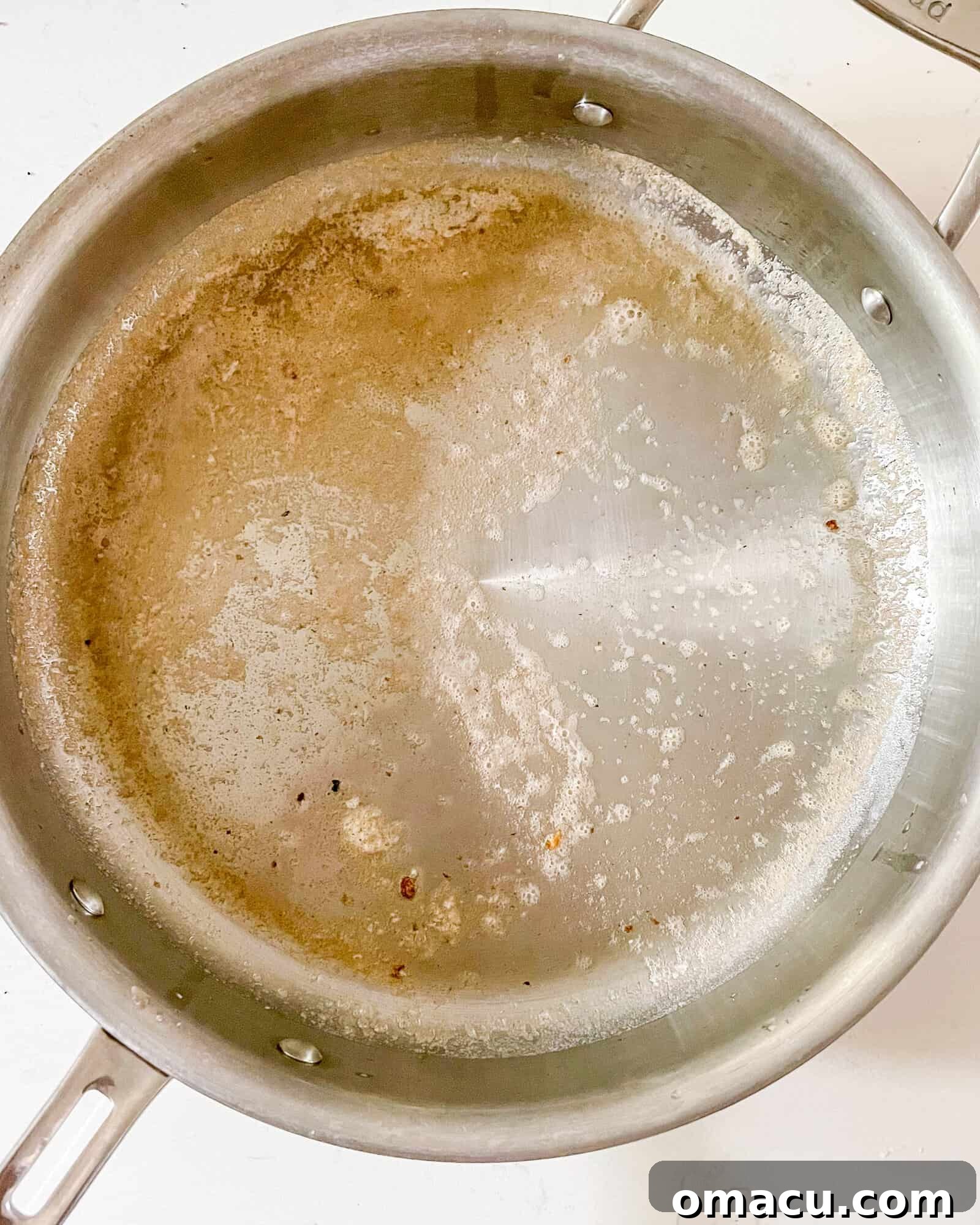 melted butter and olive oil in a frying pan.