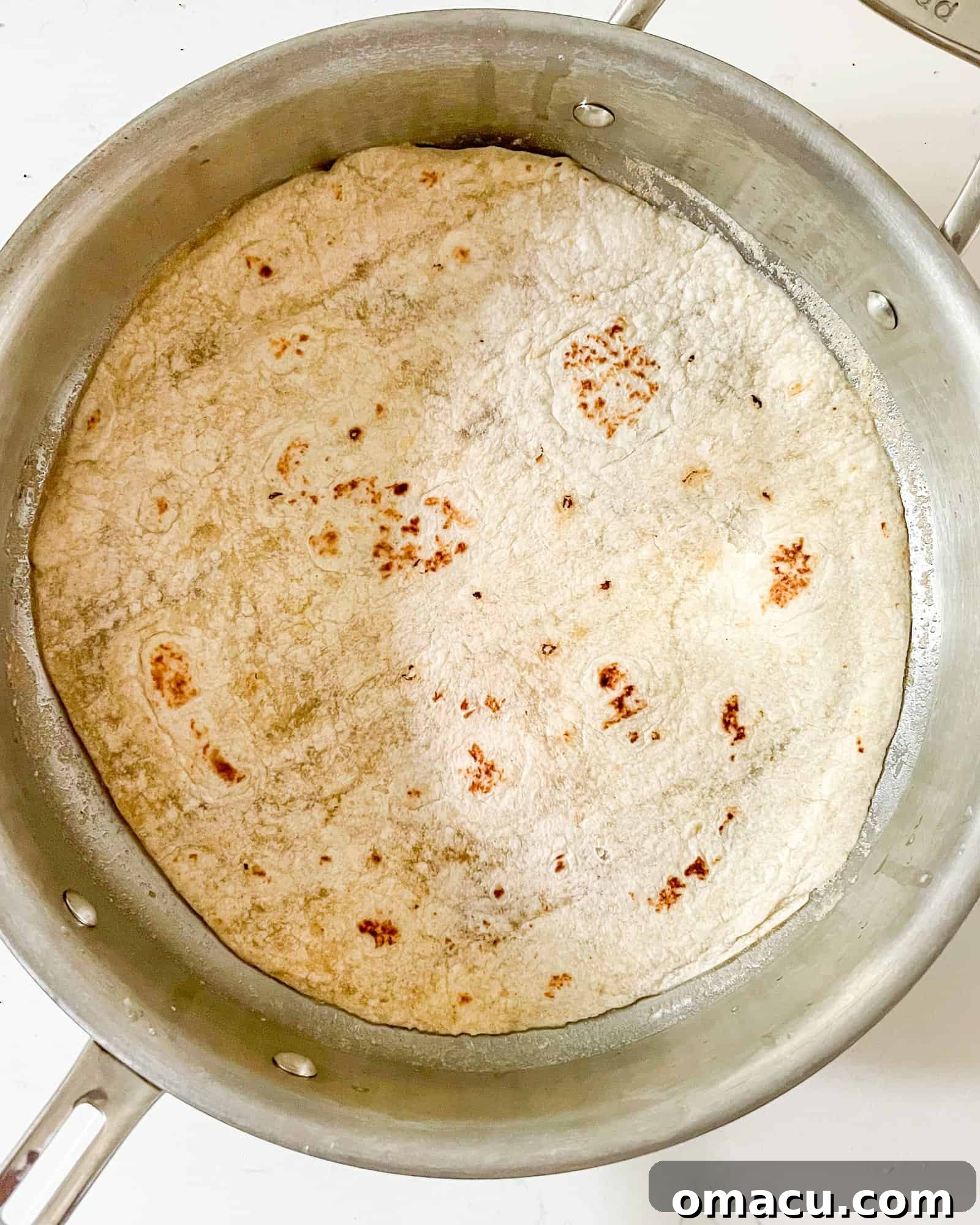 a tortilla in a frying pan.