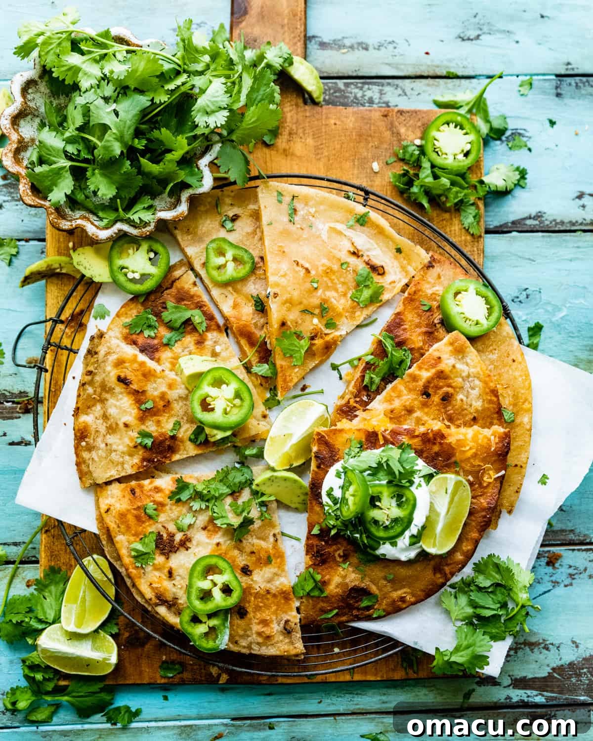 overhead photo of cheese quesadilla on a serving board.