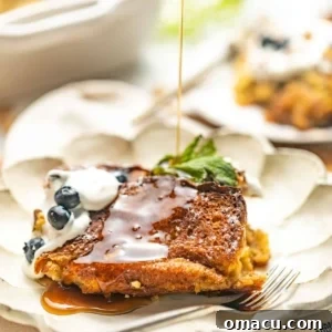 Brioche French toast casserole with maple syrup on top.