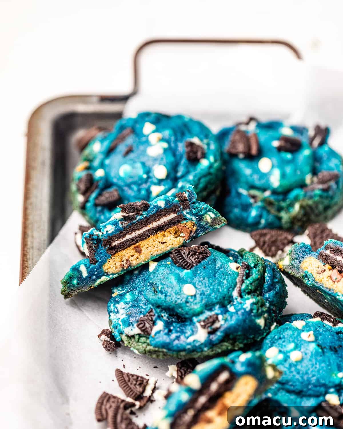 Beautifully arranged Cookie Monster Cookies on a serving tray with crushed Oreos, showcasing their vibrant blue color and tempting texture.