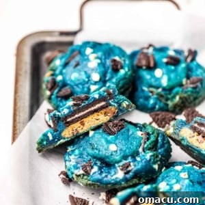 cookie monster cookies on a serving tray with crushed oreos.