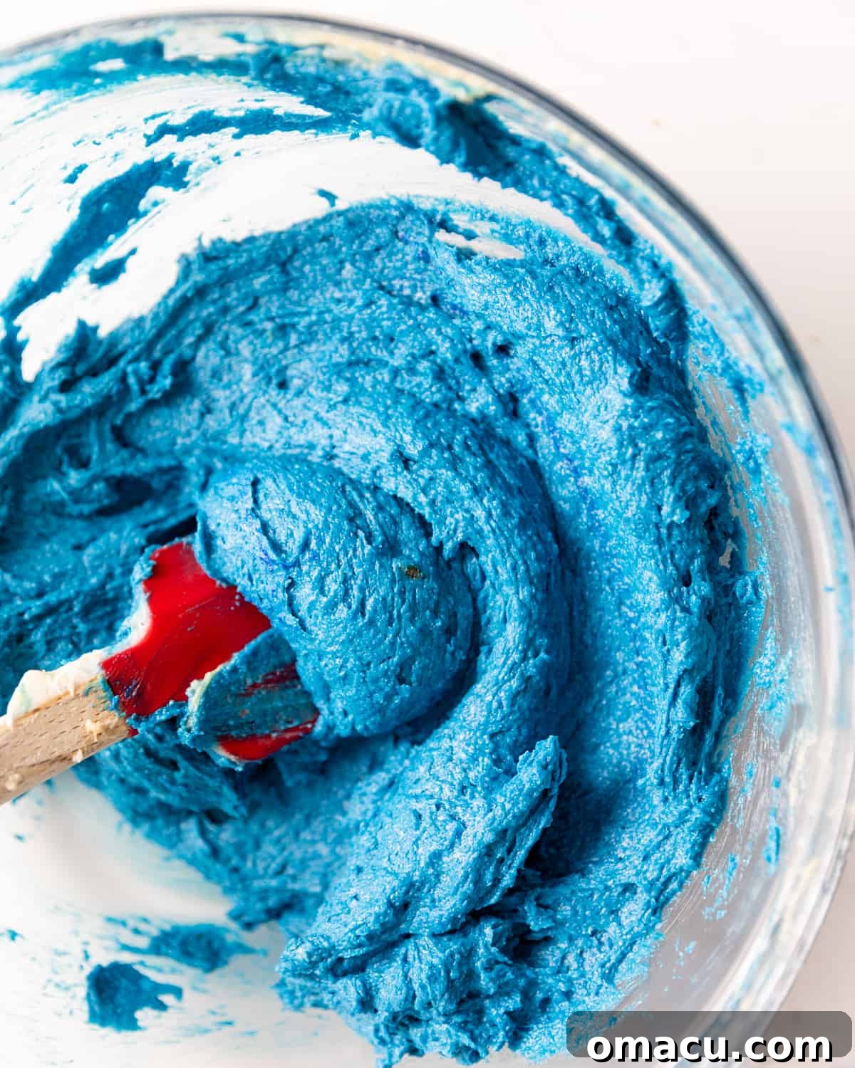 Vibrant blue cookie monster cookie dough with food coloring fully incorporated, ready for mix-ins.