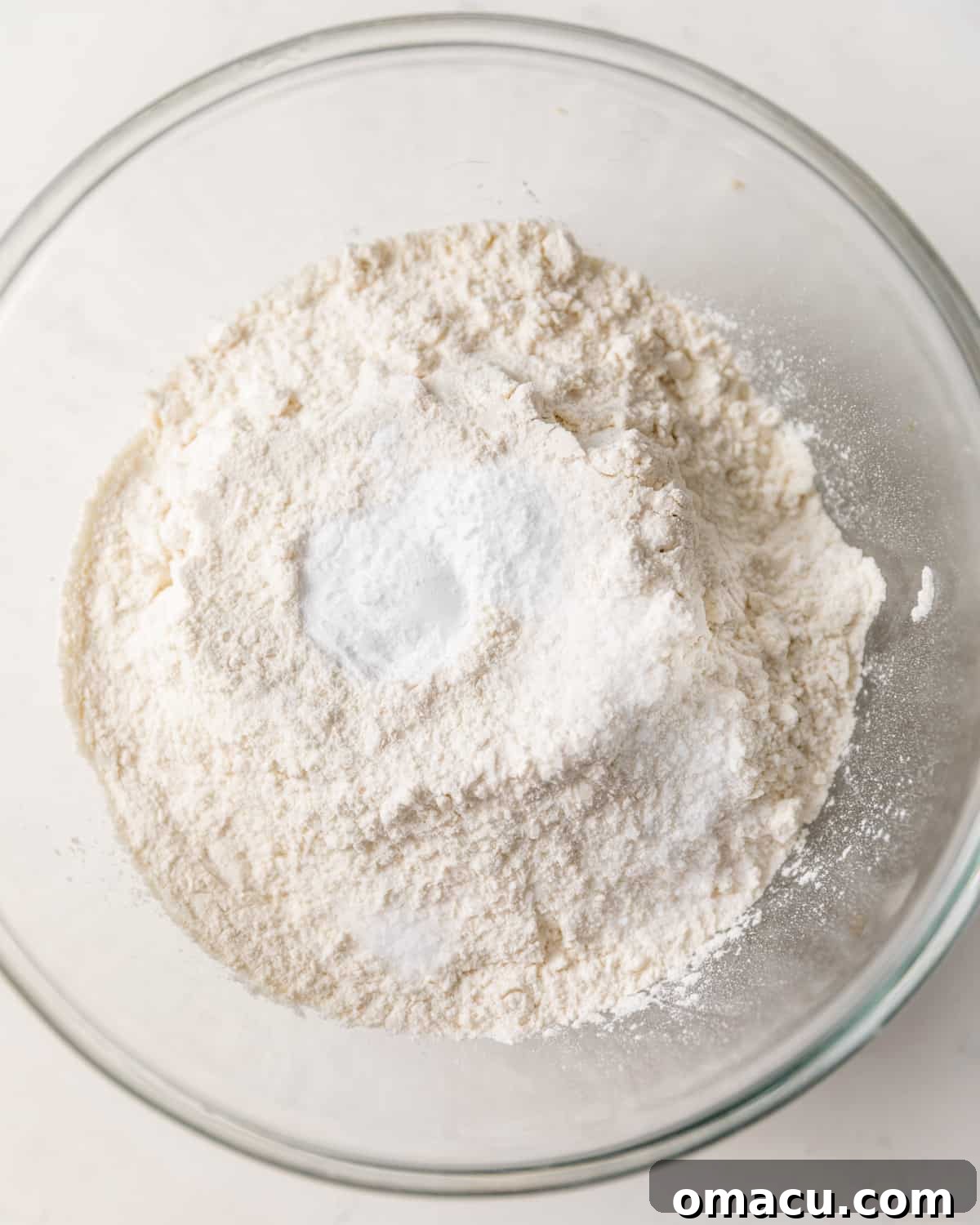 The dry ingredients – all-purpose flour, baking soda, baking powder, and salt – meticulously mixed in a bowl.
