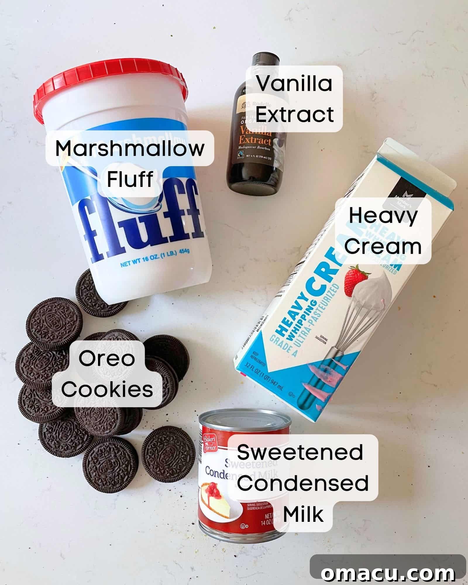 Essential ingredients for homemade Oreo ice cream: cold heavy cream, a can of sweetened condensed milk, vanilla extract, fluffy marshmallow cream, and a stack of classic Oreo cookies.