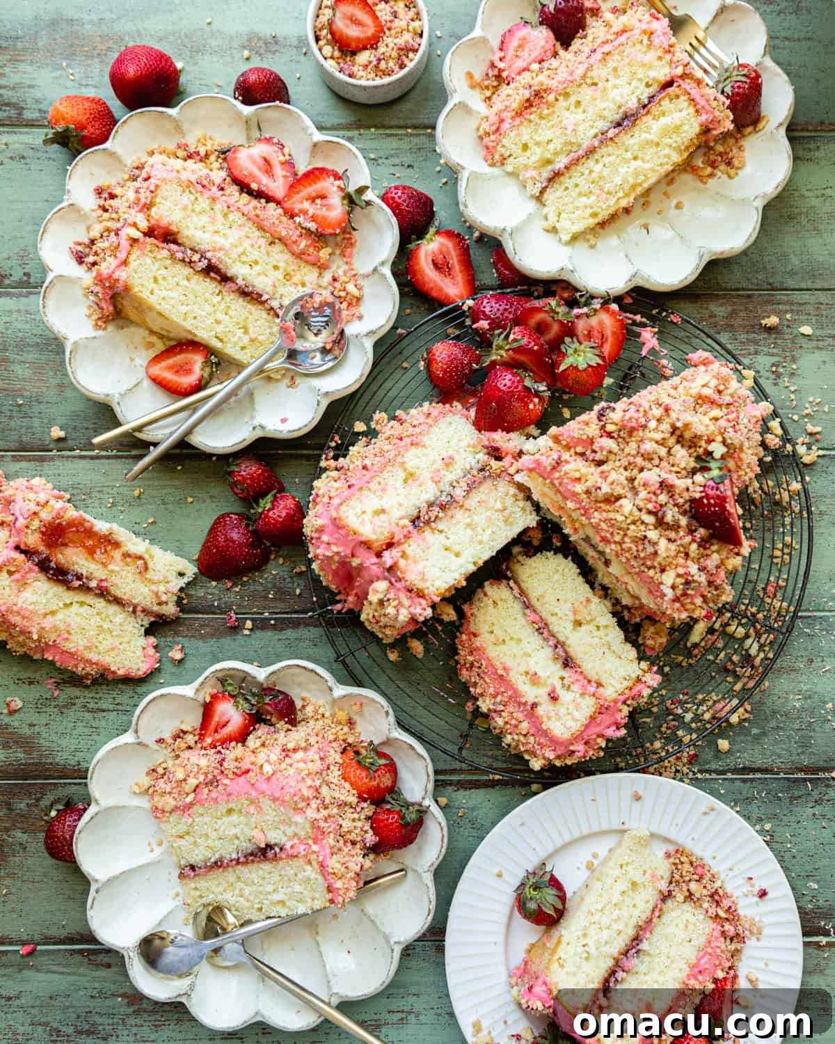 slices of strawberry crunch cake on a plate, showcasing its beautiful layers.