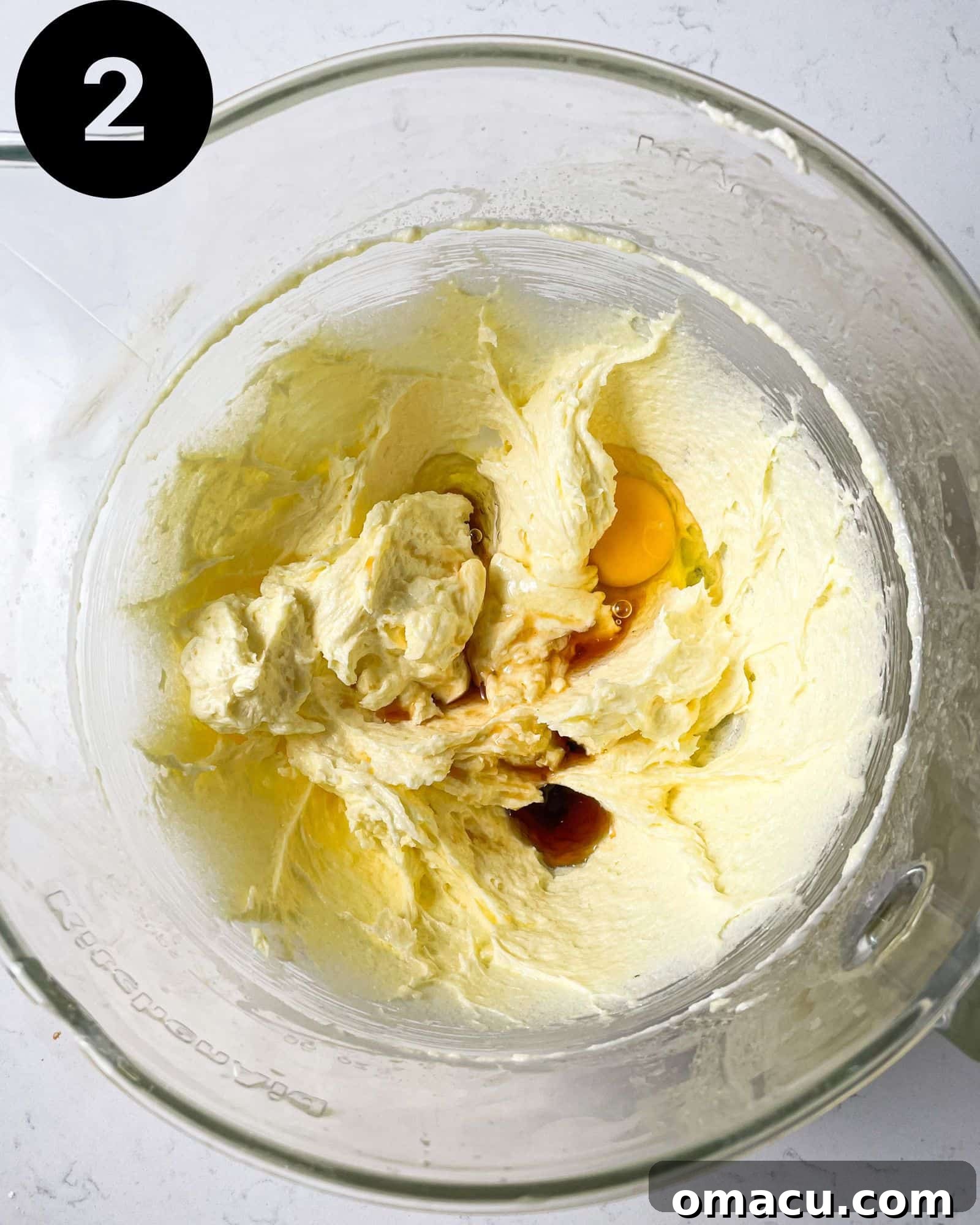 butter and sugar creamed together in a stand mixer with eggs and vanilla extract being added.
