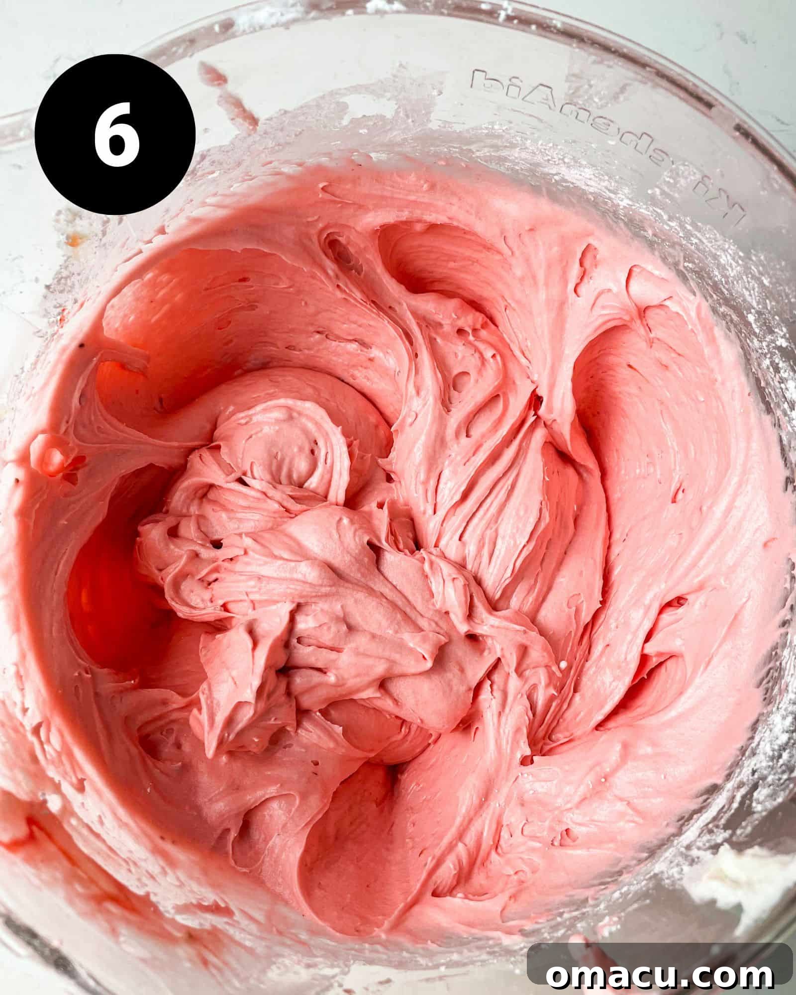 strawberry cream cheese frosting in a bowl, ready to be spread.
