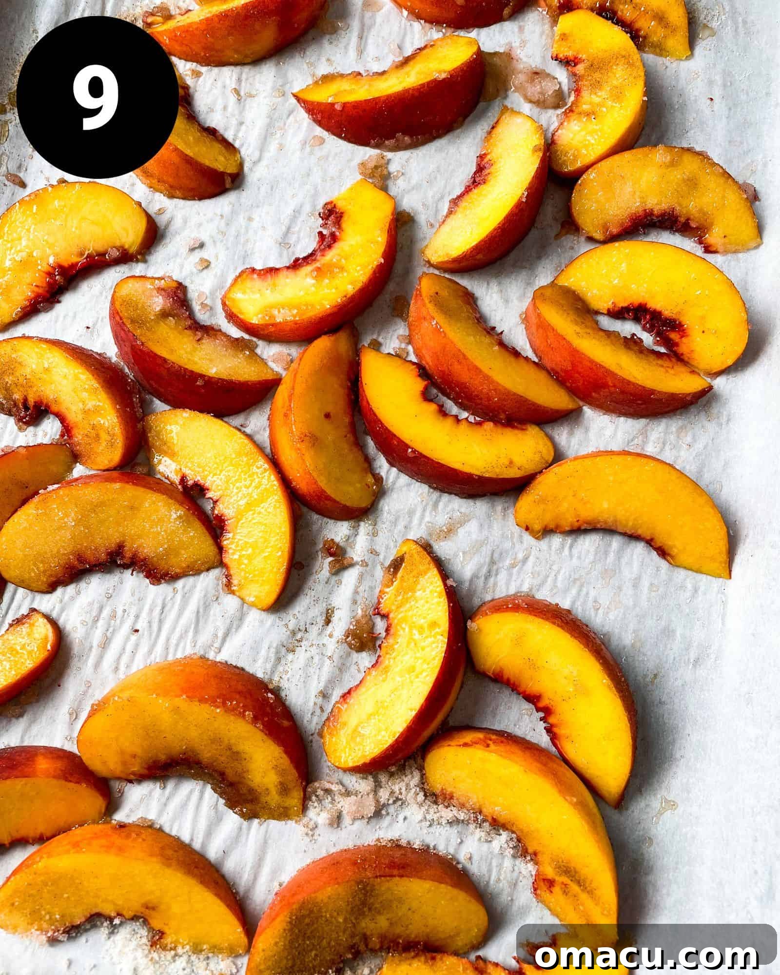 roasted peaches on a parchment lined baking sheet.