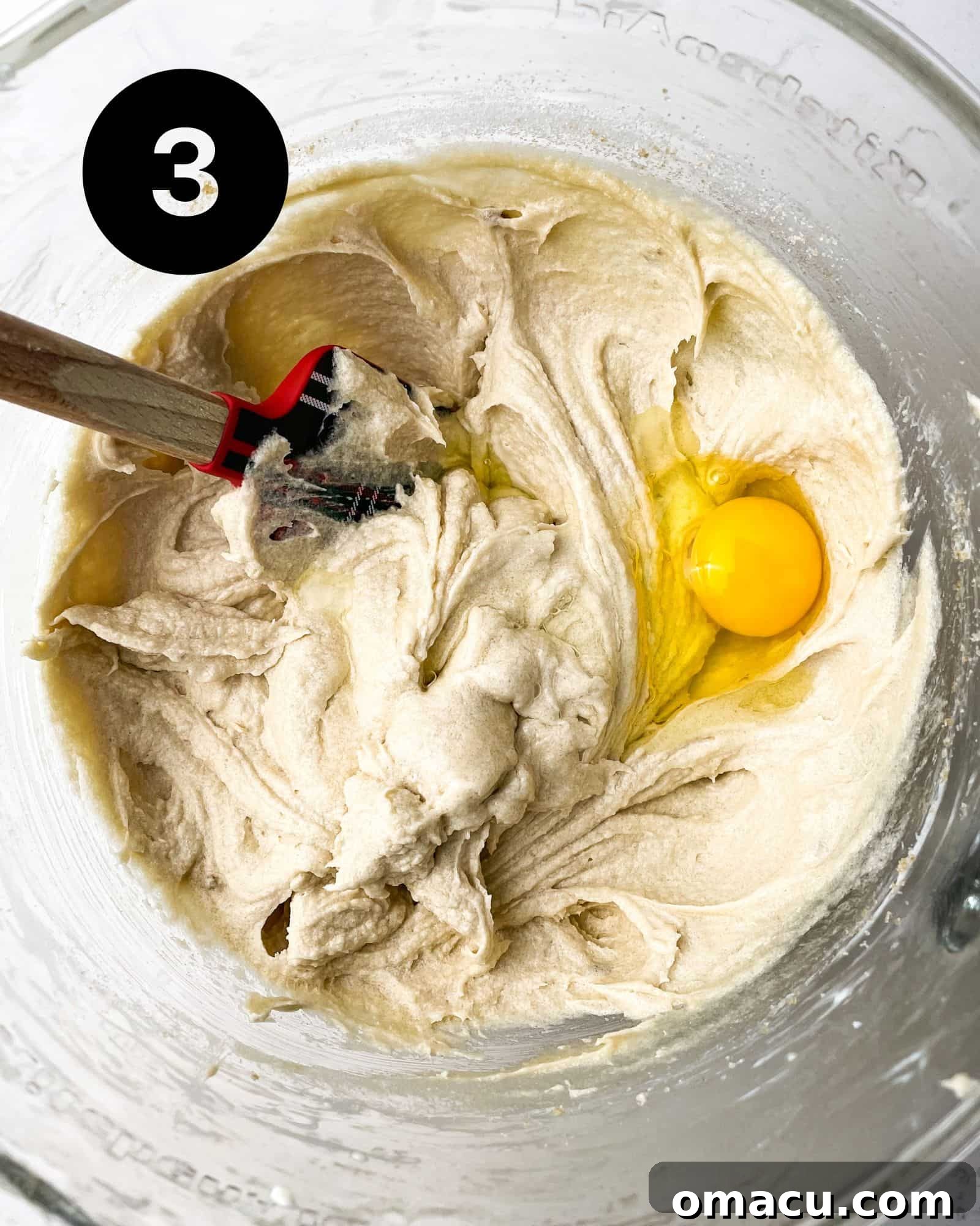pound cake batter with an egg in a bowl.