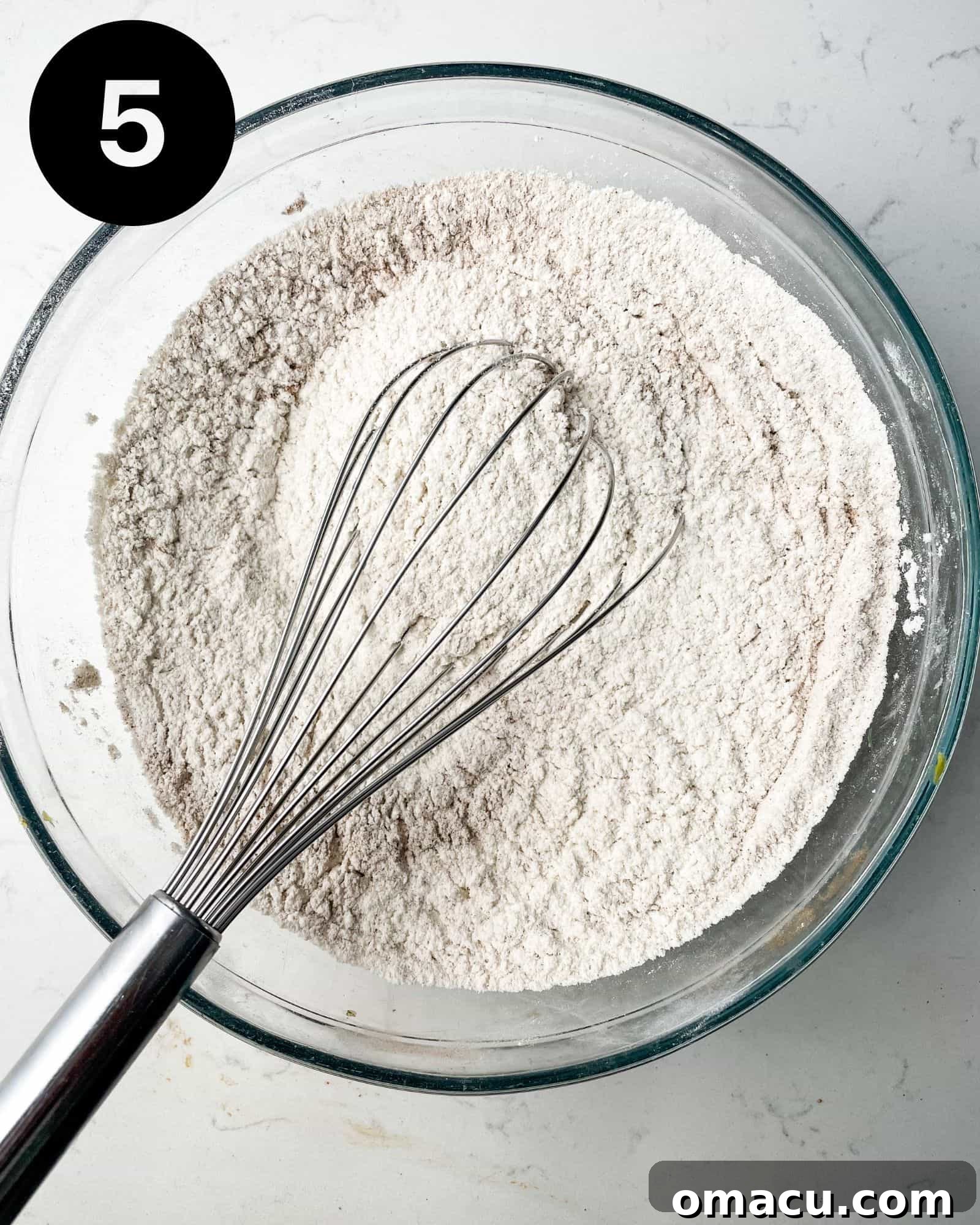 flour, cinnamon, nutmeg, and salt mixed together in a bowl.