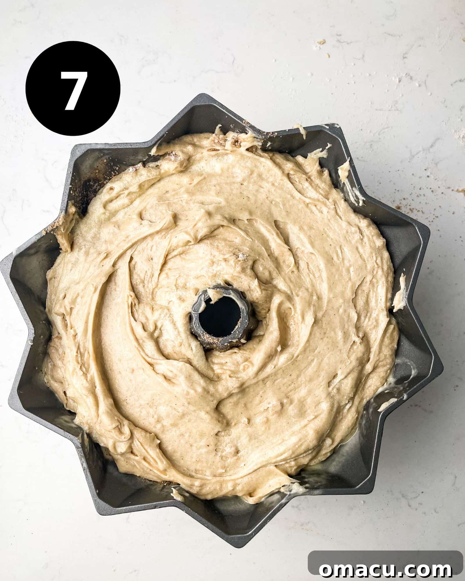 pound cake batter in a bundt pan.