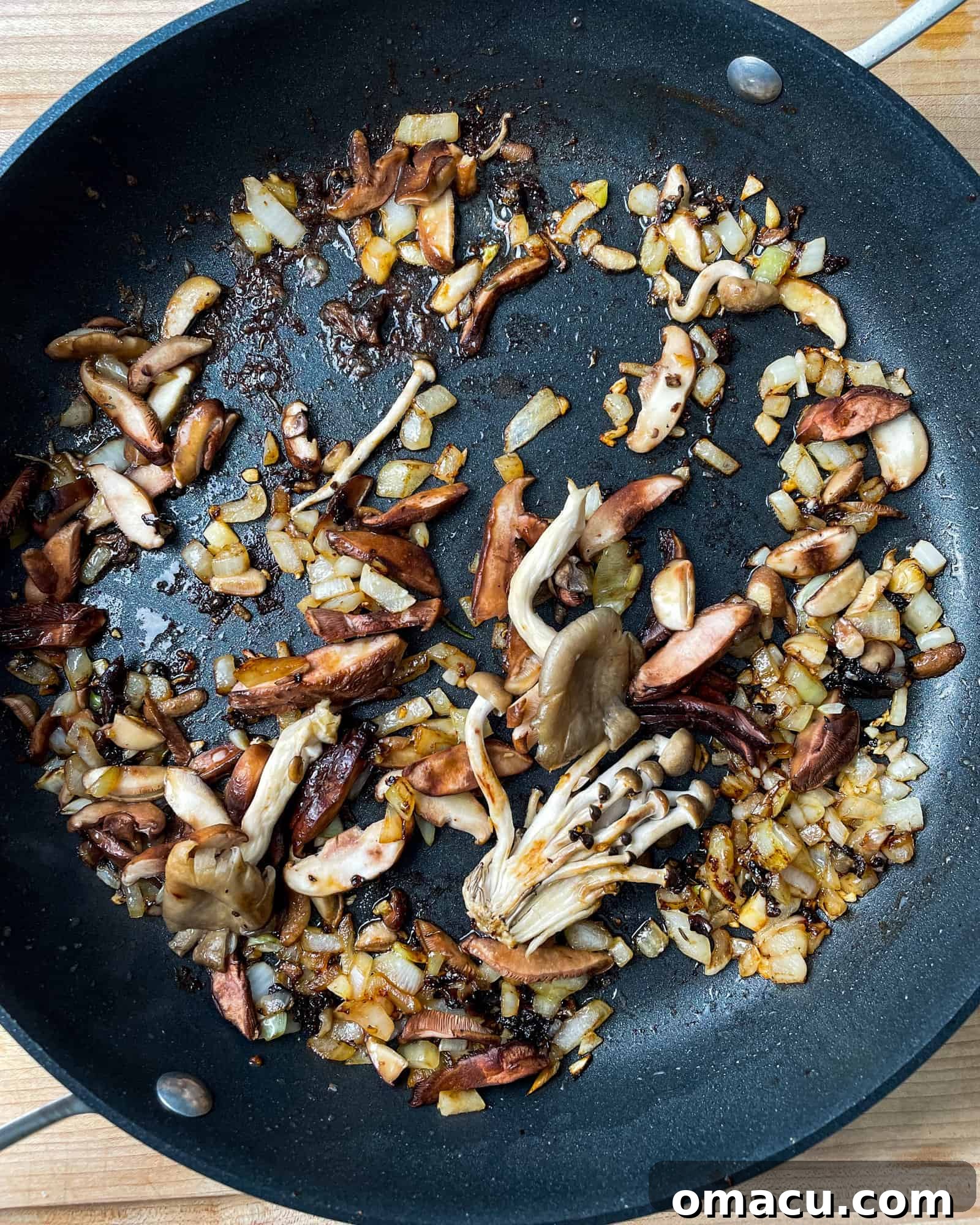 Sautéed mushrooms cooked to perfection in a frying pan.