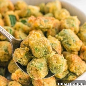 Crispy, golden-brown fried okra pieces piled high, ready to be served.