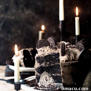 blac velvet cake on a large plate with oreos on top.