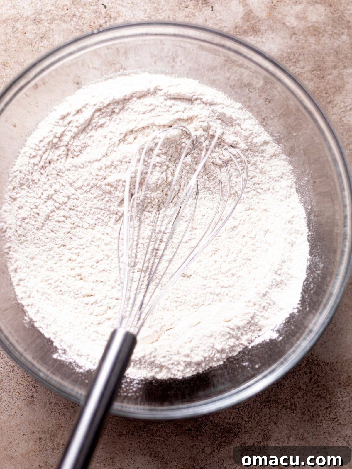 Dry ingredients (flour, black cocoa powder, espresso powder, leavening agents, salt) neatly mixed in a separate bowl.