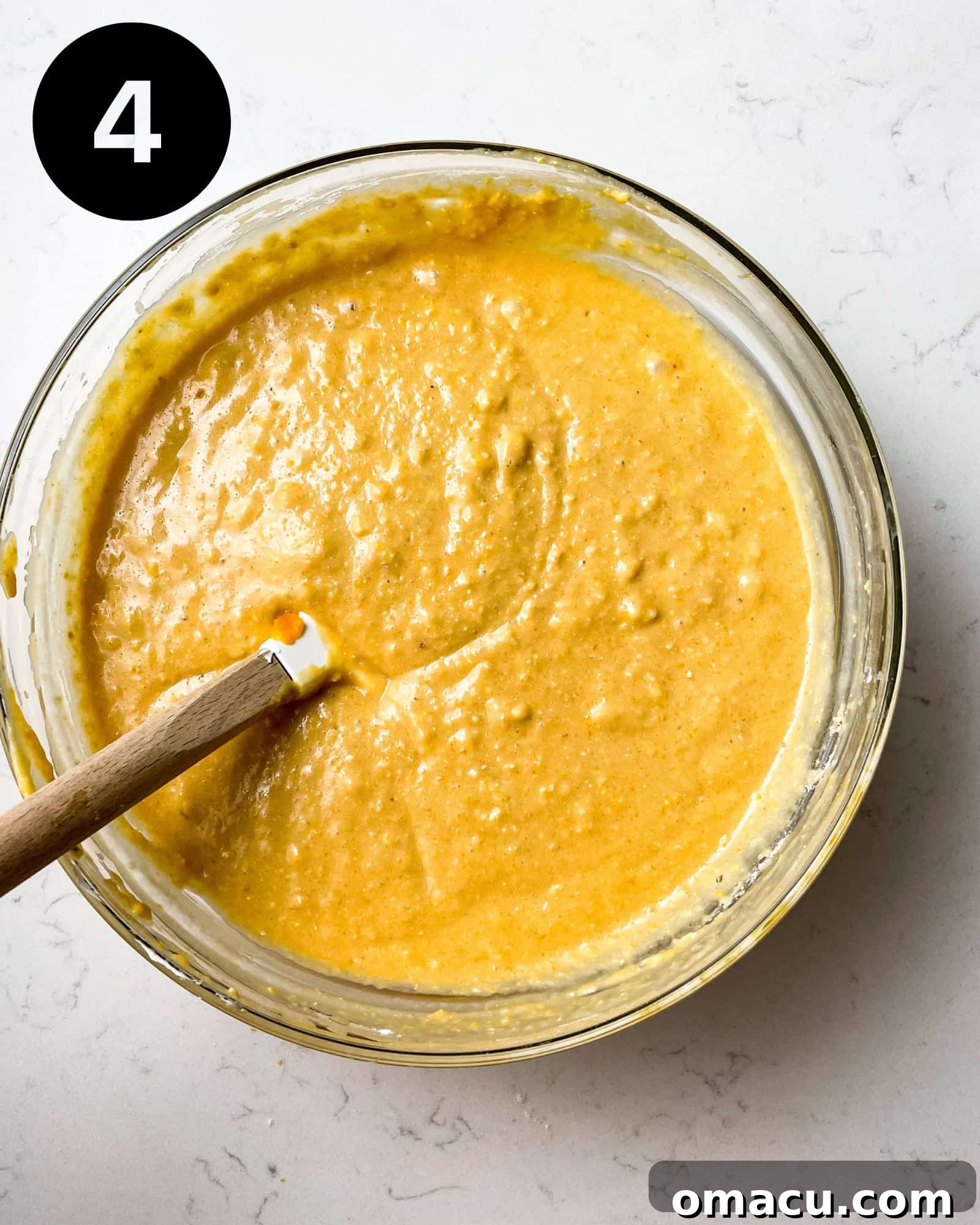 sweet potato cornbread batter in a bowl, ready for baking.