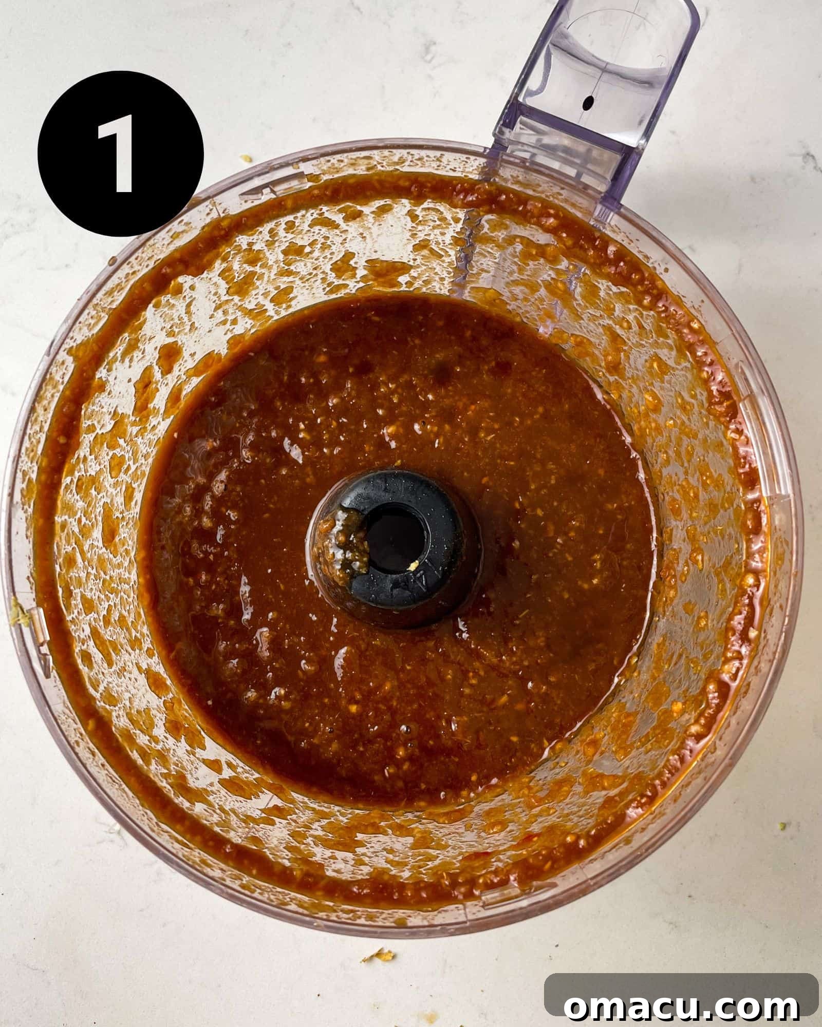 The bulgogi sauce ingredients being blended to a smooth consistency in a food processor.