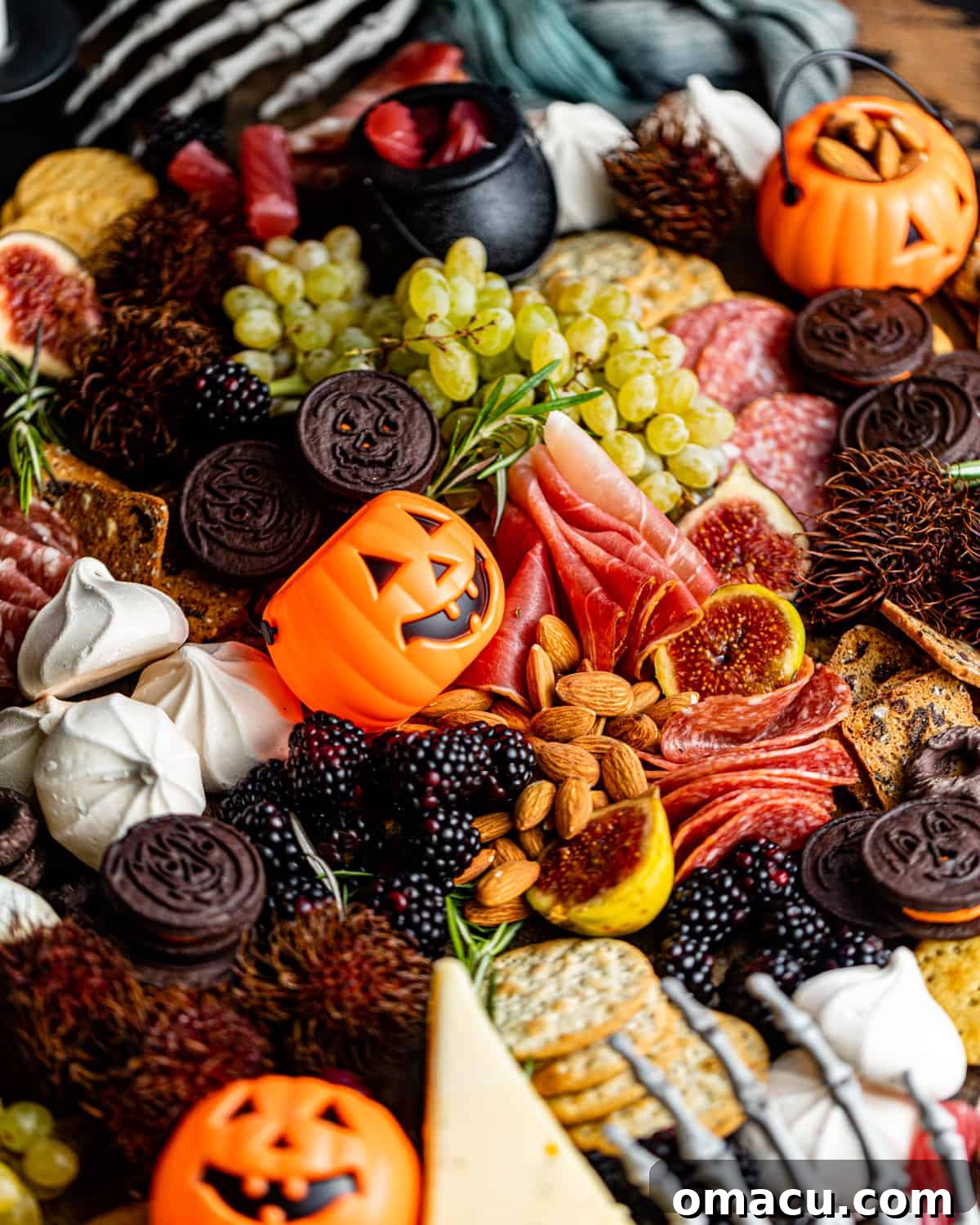 A close-up photograph of the delicious and spooky food items meticulously arranged on the charcuterie board.