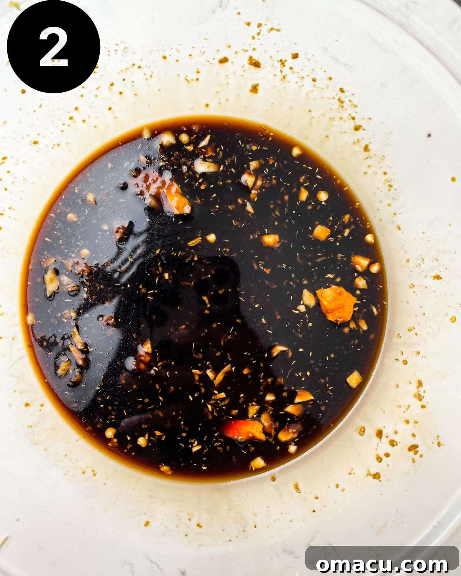 Pepper steak sauce ingredients mixed in a bowl.