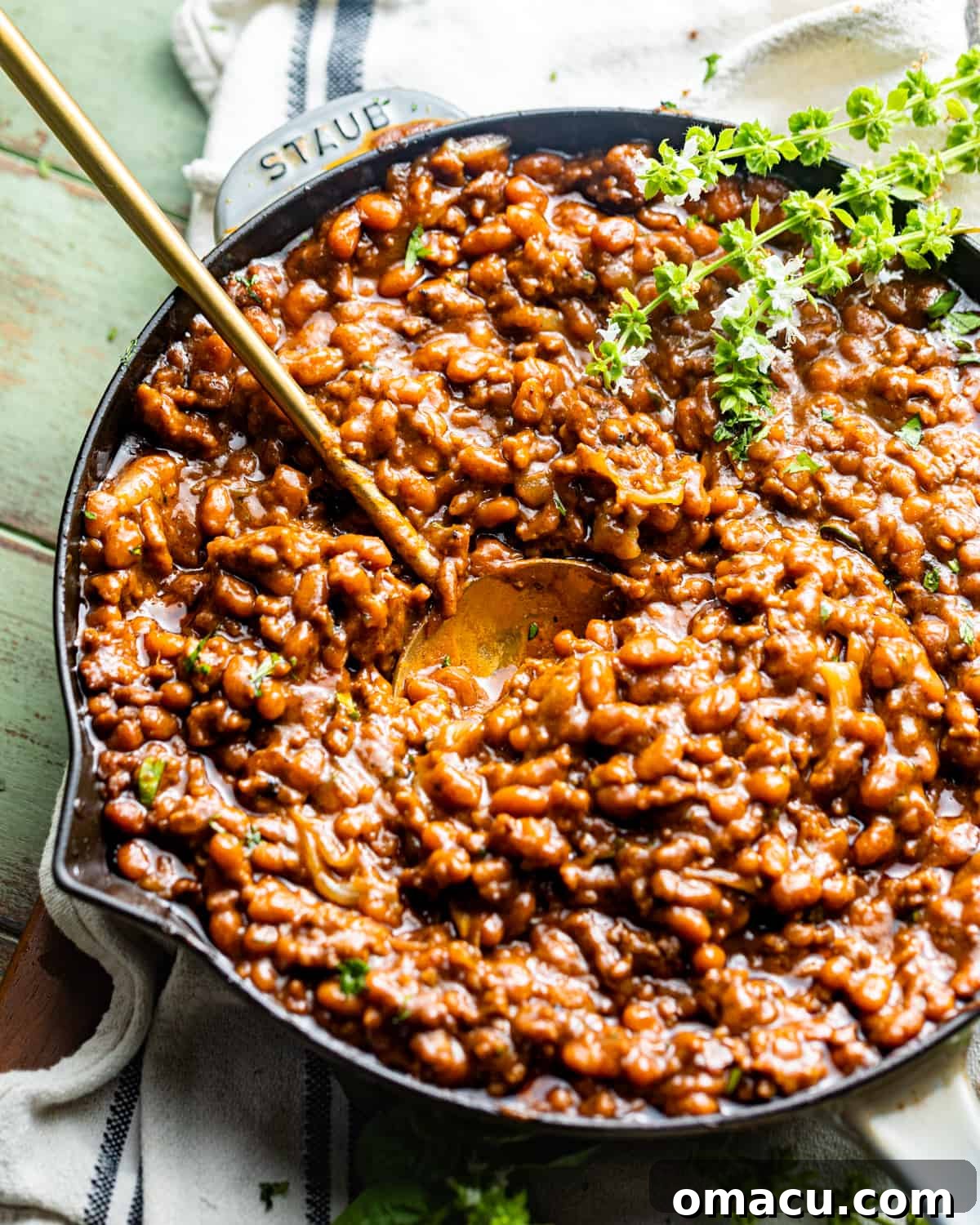 baked beans with ground beef in a large skillet, ready to be served.