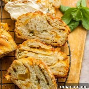 sliced cheese babka on a cooling rack.