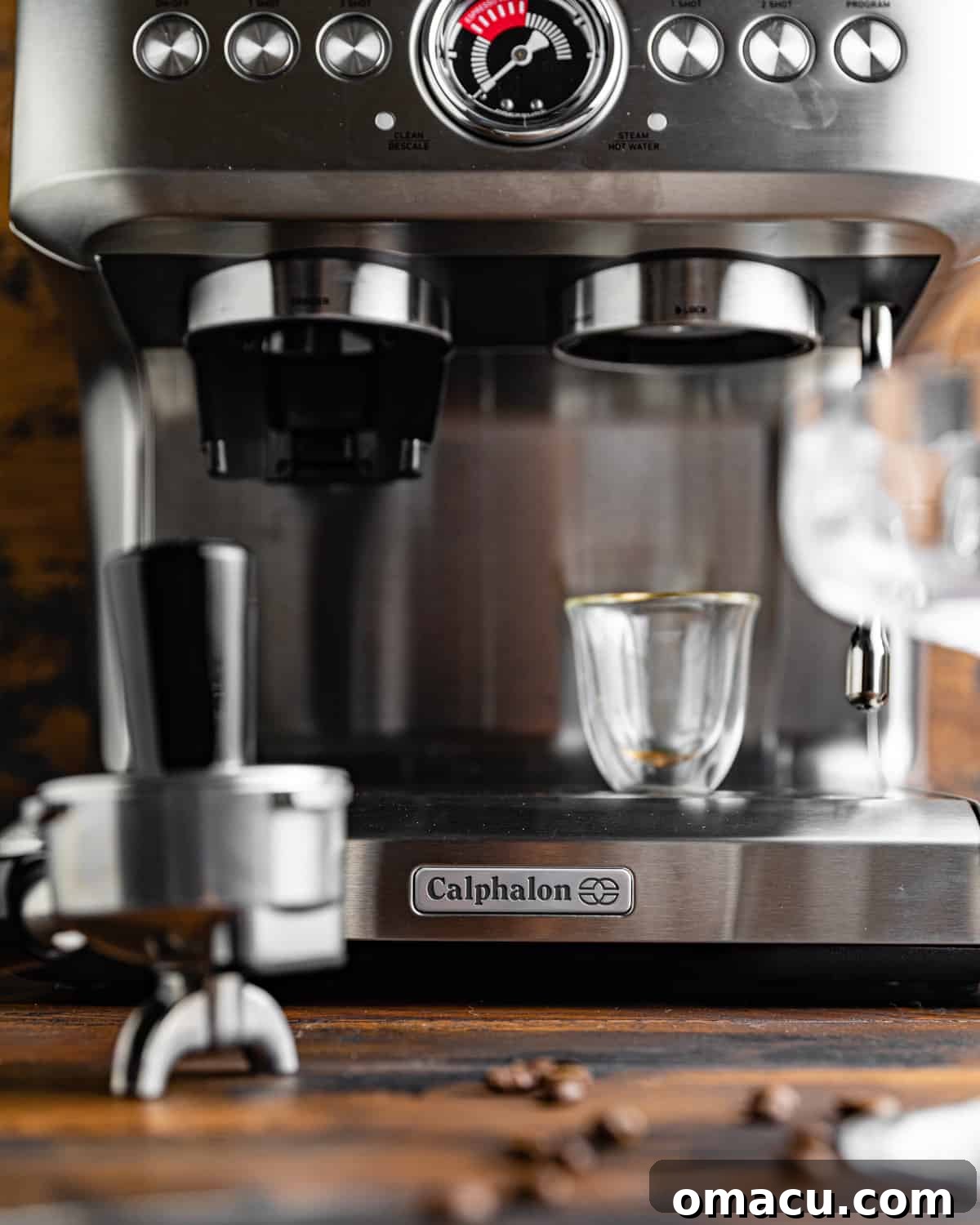 An espresso machine brewing fresh espresso into two cups, highlighting the importance of quality coffee.