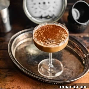 An espresso martini in a coupe glass, showcasing the creamy foam.
