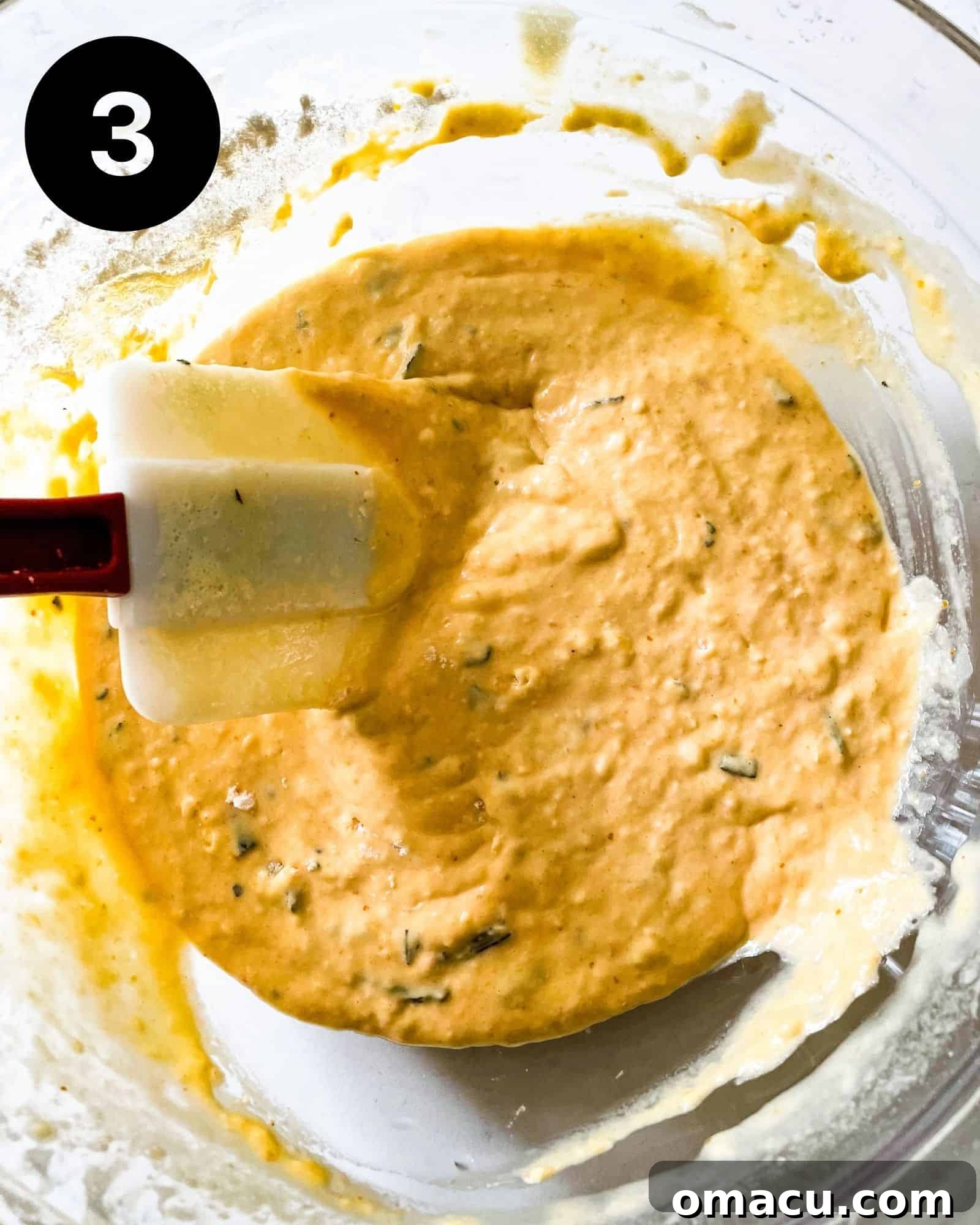 Smooth, well-combined popover batter in a bowl, ready to be poured into the hot pan.