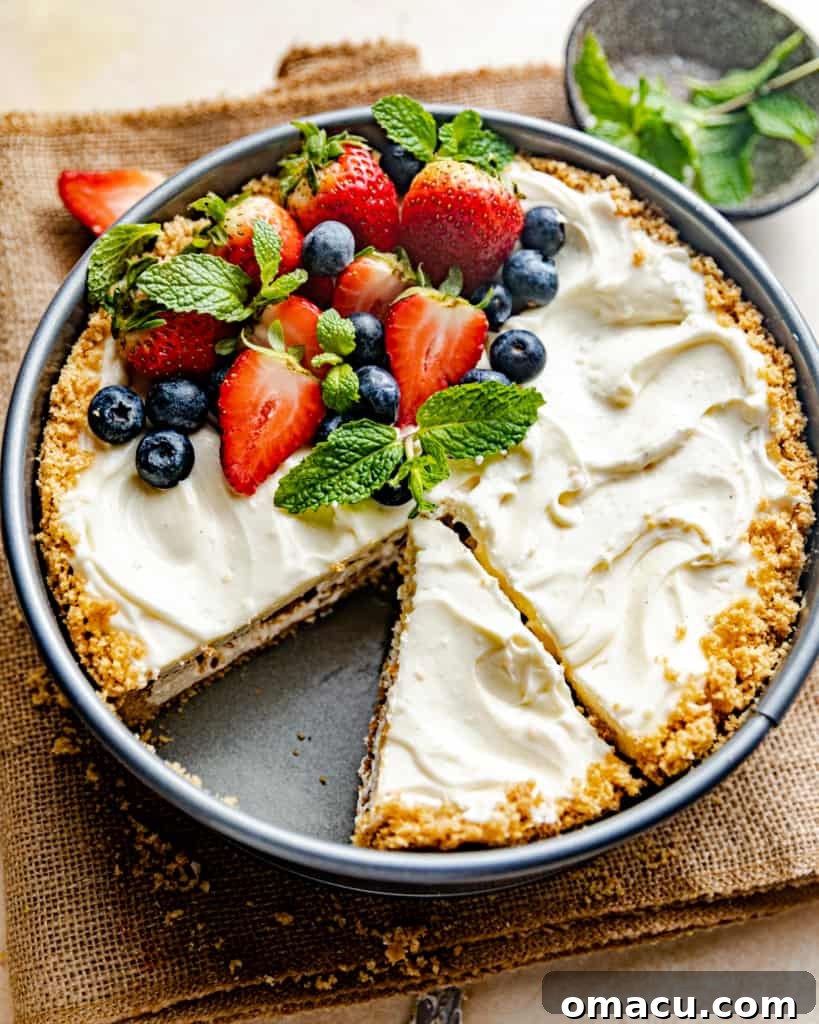 A whole Philadelphia No-Bake Cheesecake perfectly set in a springform pan, ready to be served.